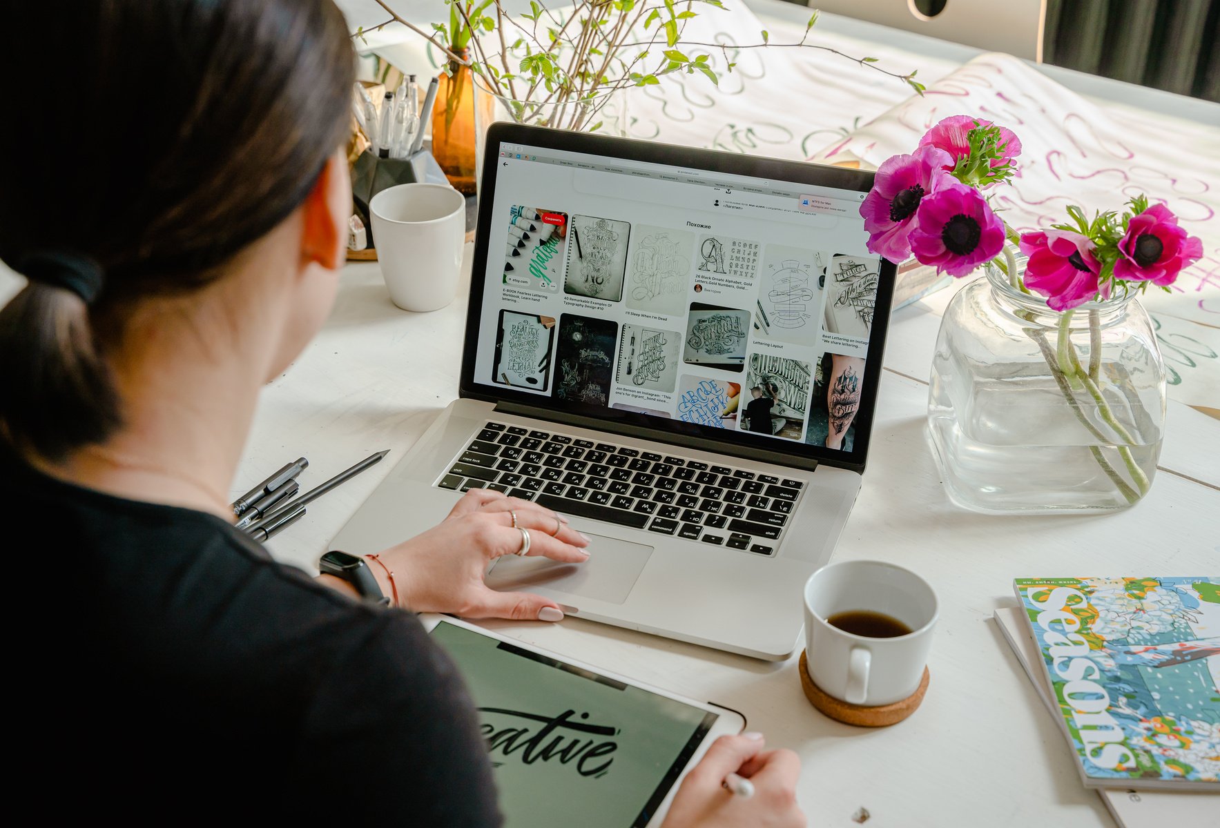 A woman typing on a laptop